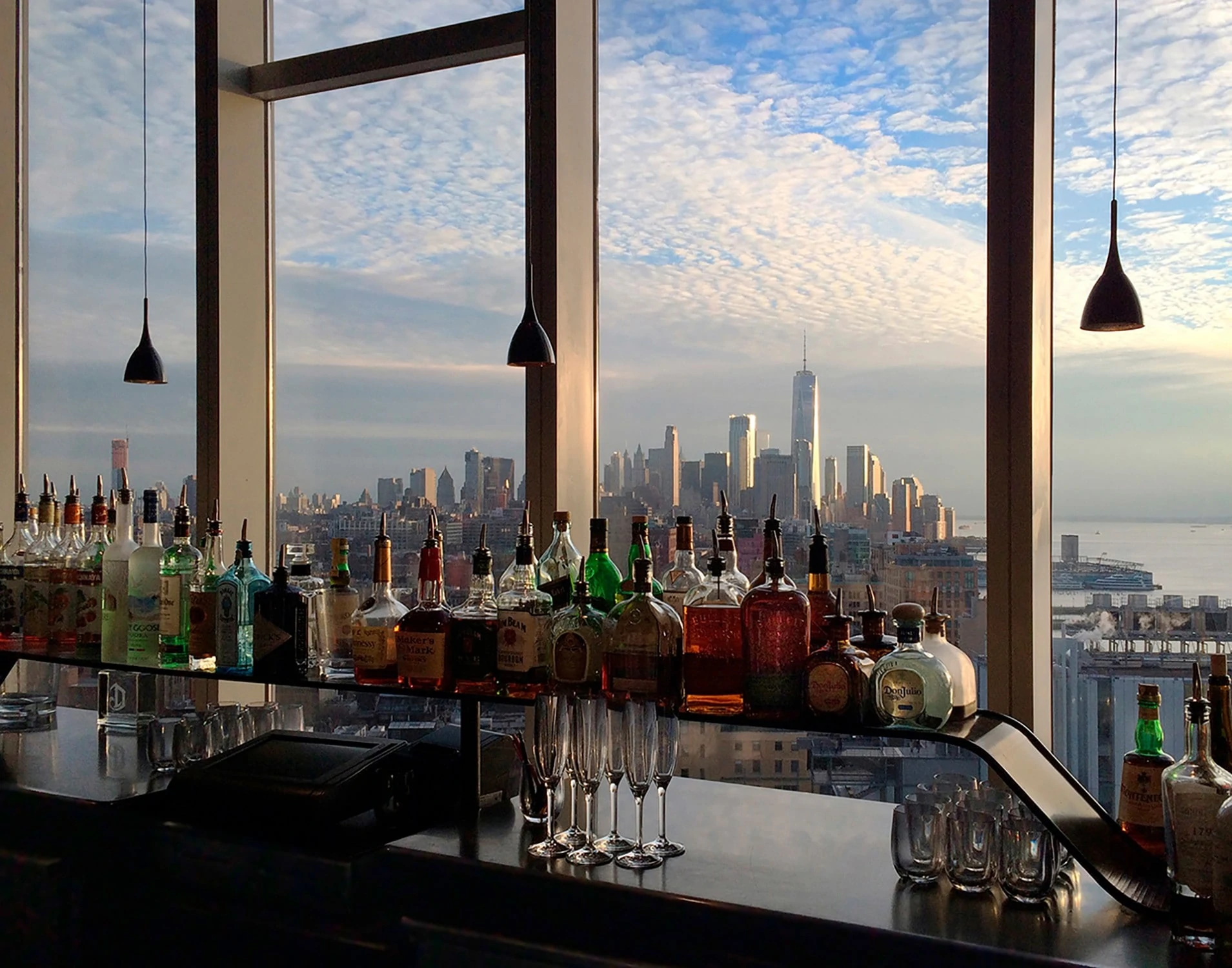 OUT THE WINDOW: Lower Manhattan Skyline seen from The Standard Hotel bar -- bottles, glasses