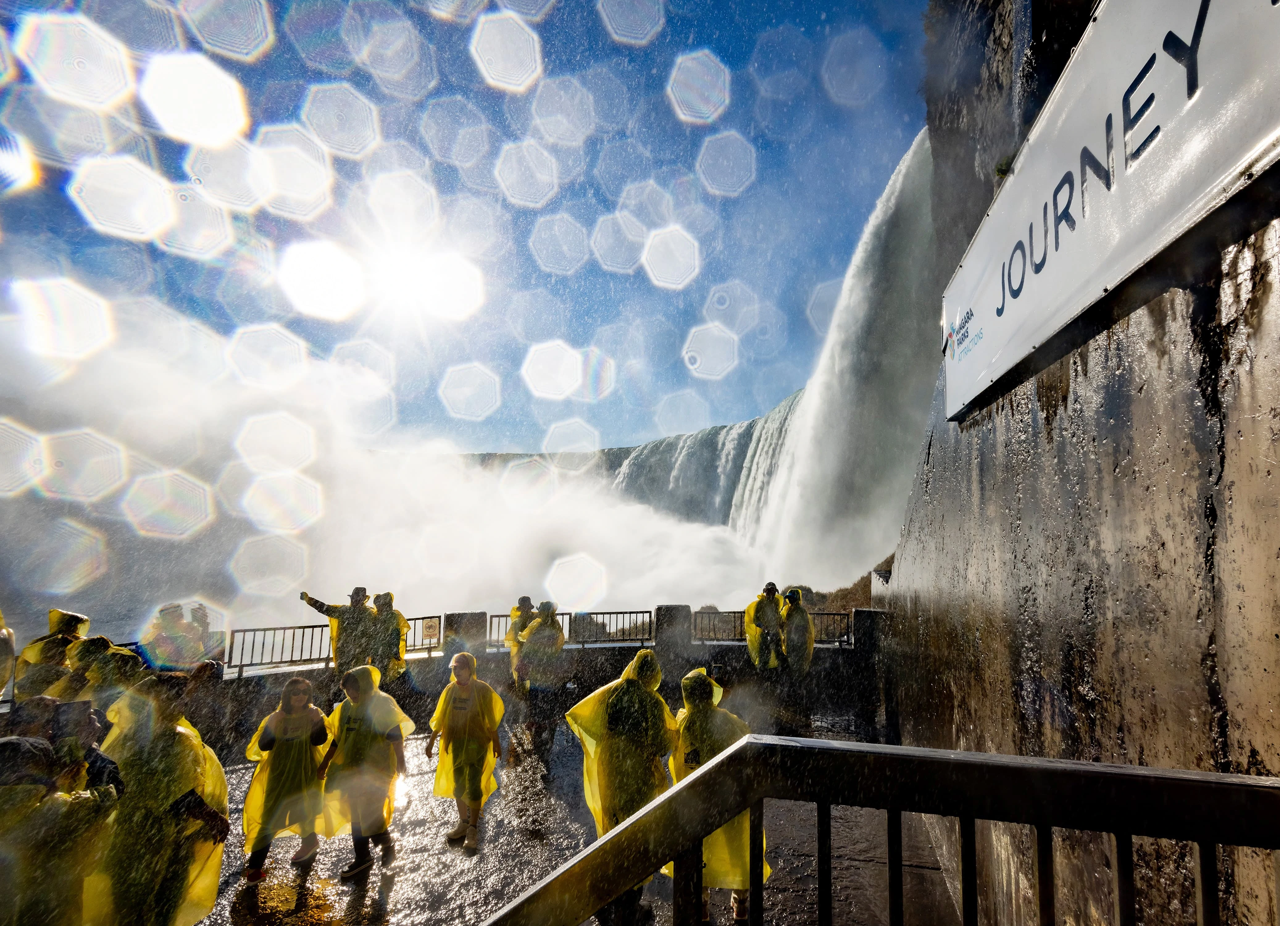 Visitors in yellow raincoats at Niagara Parks Journey, Ontario