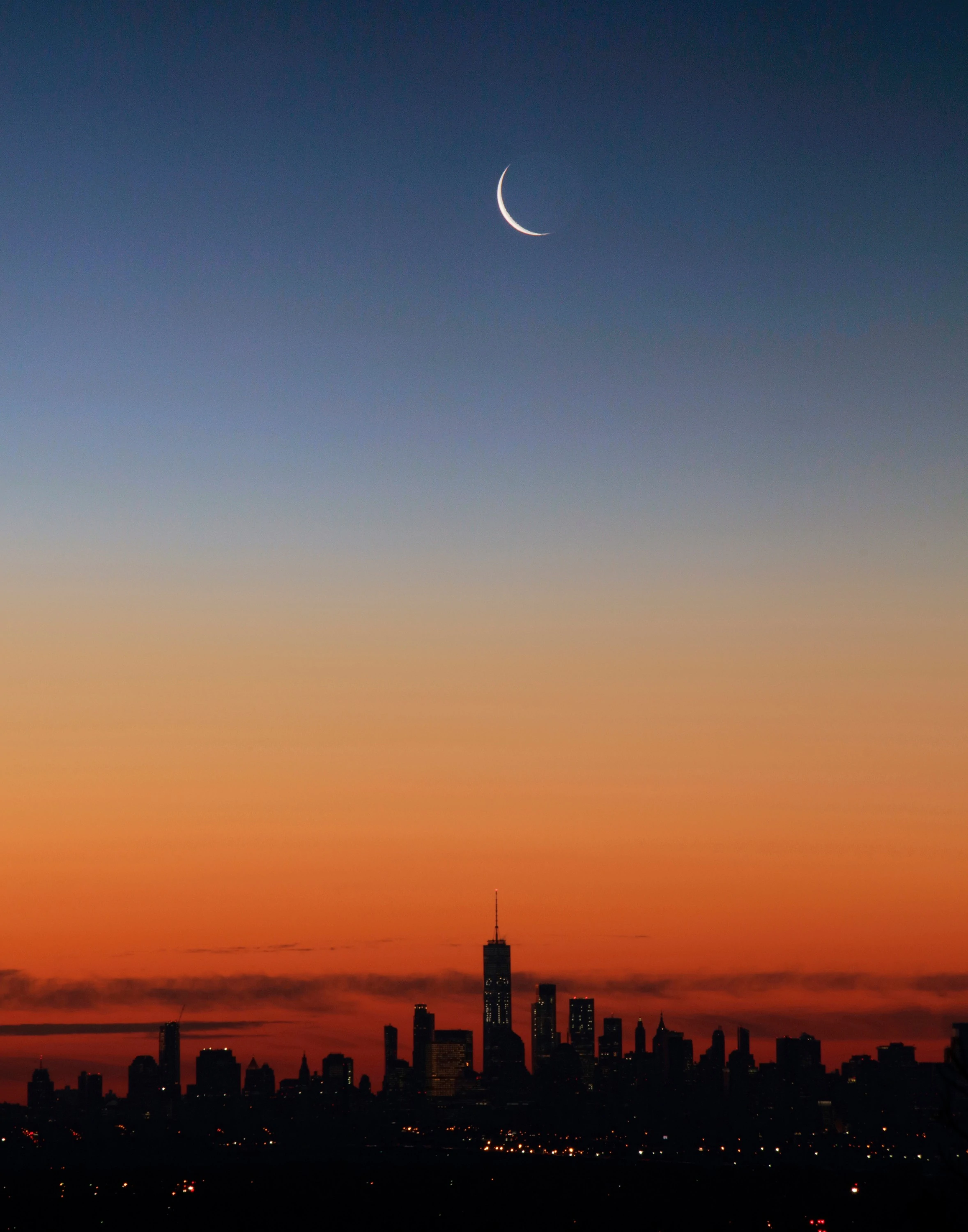 OUT THE WINDOW: Moonrise at dawn NYC and Jersey City Skyline from Montclair NJ