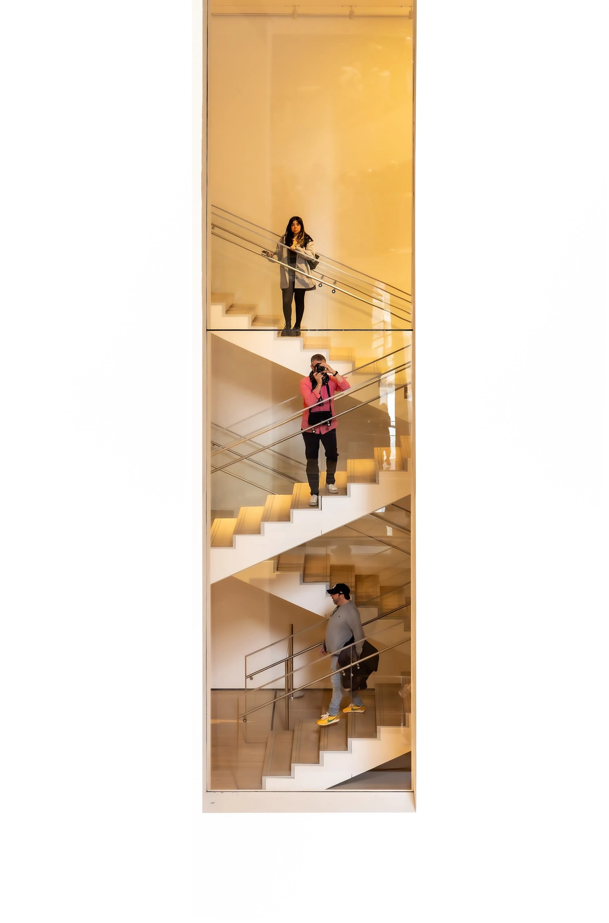 Interior staircase with peope at Museum of Modern Art, NYC