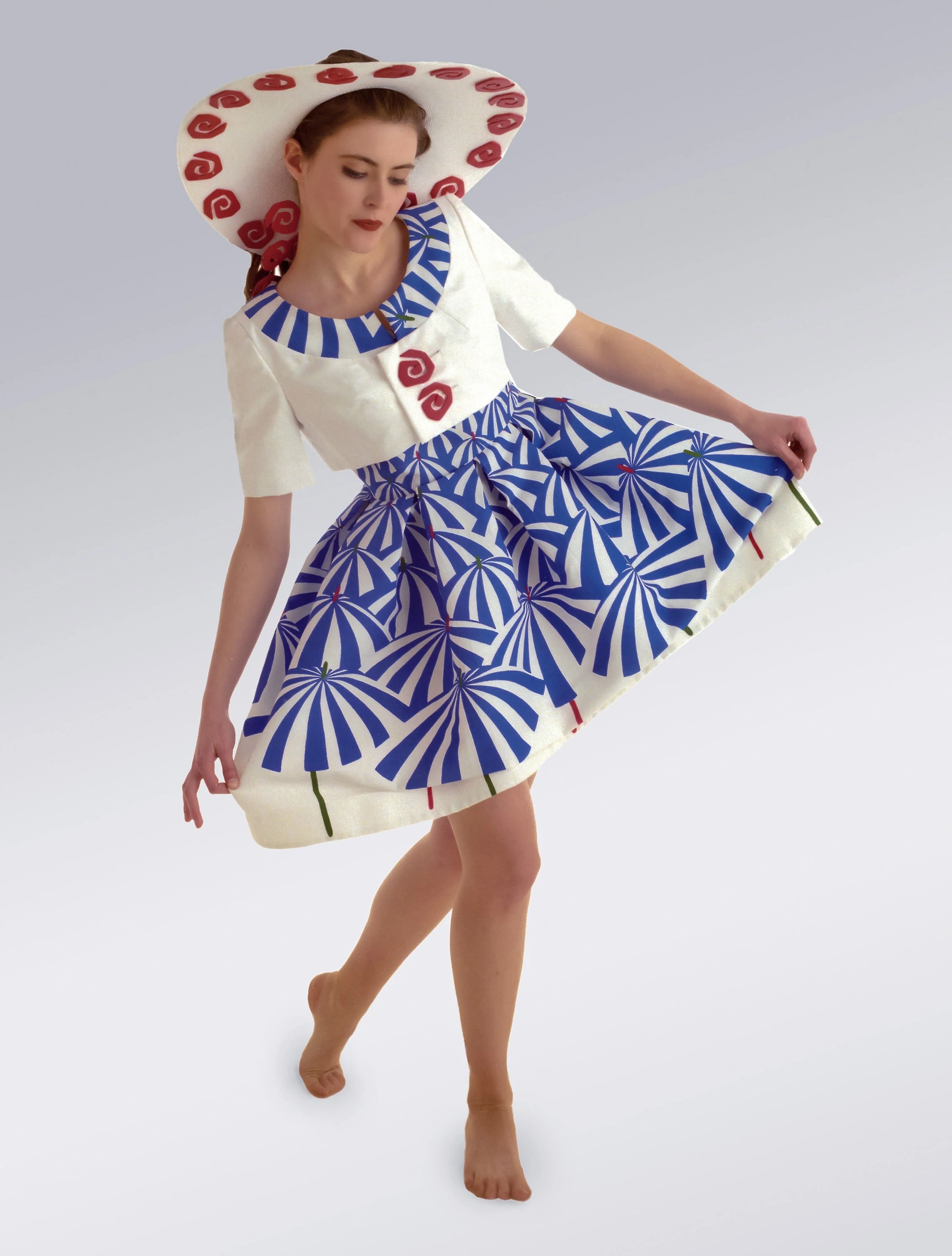 Woman walking barefoot in a Blue Umbrella Dress