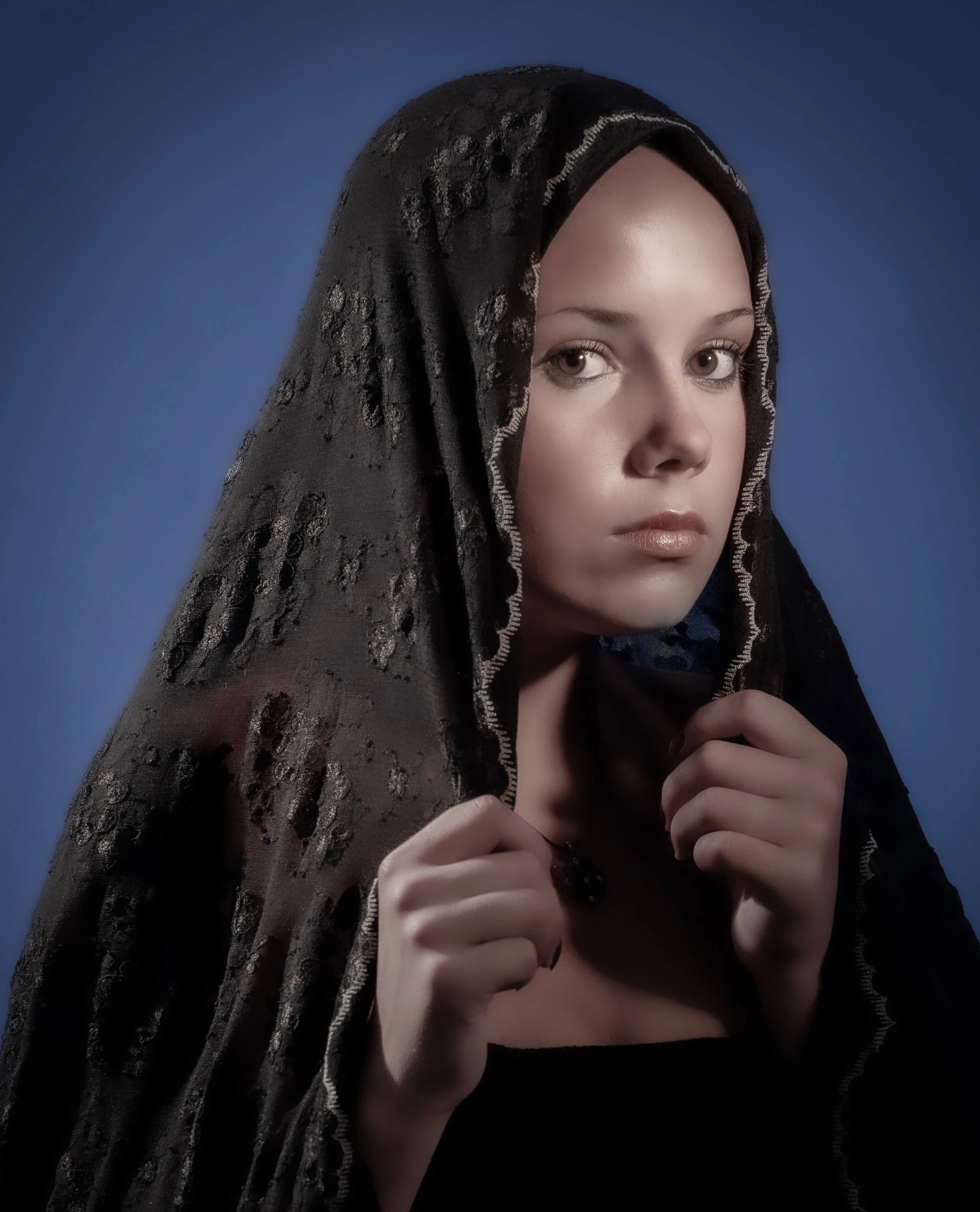 Portrait of young woman in shawl