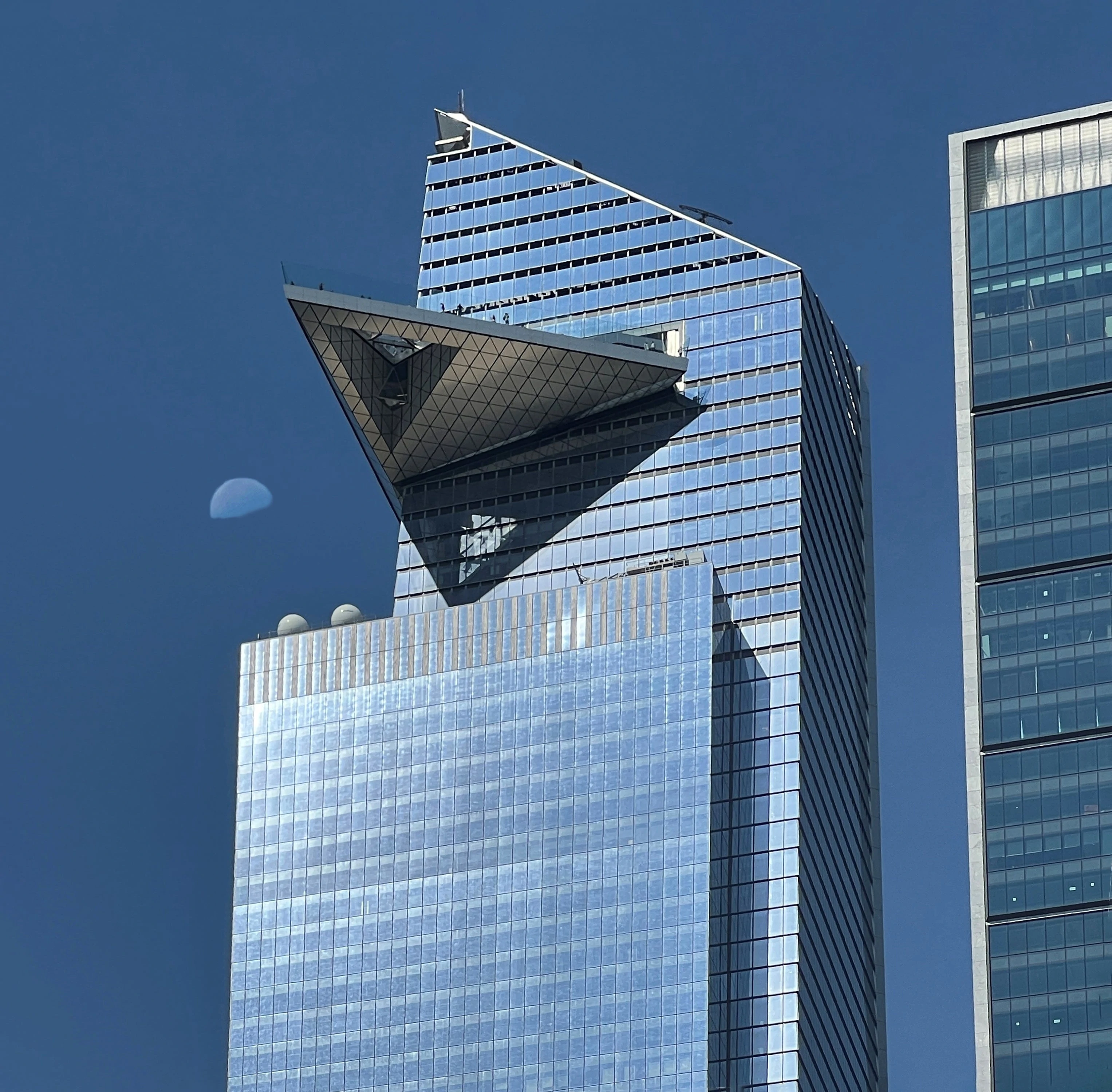 The Edge, Hudson Yards NY with a half moon overhead