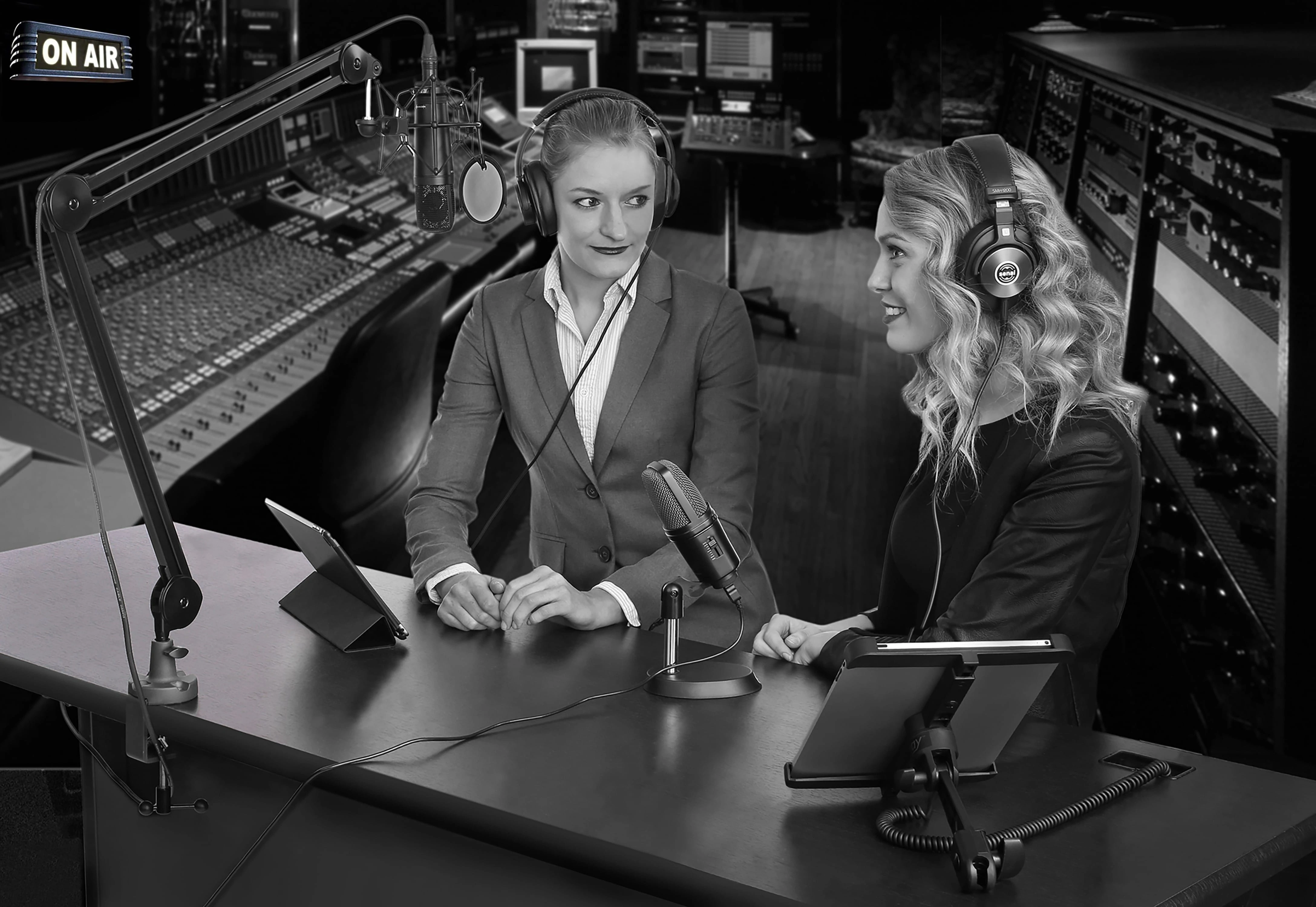 Microphones, Boom Arms, Headphones in Use by two women in studio setting